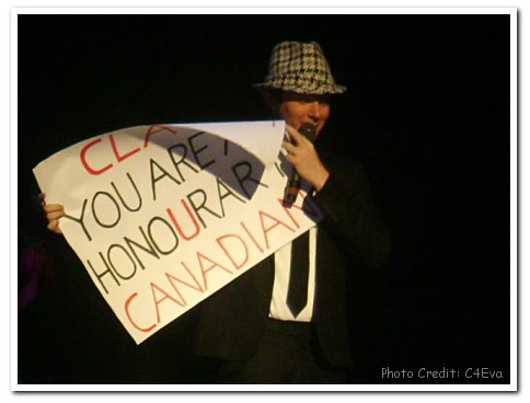 Clay Aiken holding sign: Clay You Are An Honourary Canadian - Photo Credit: C4Eva